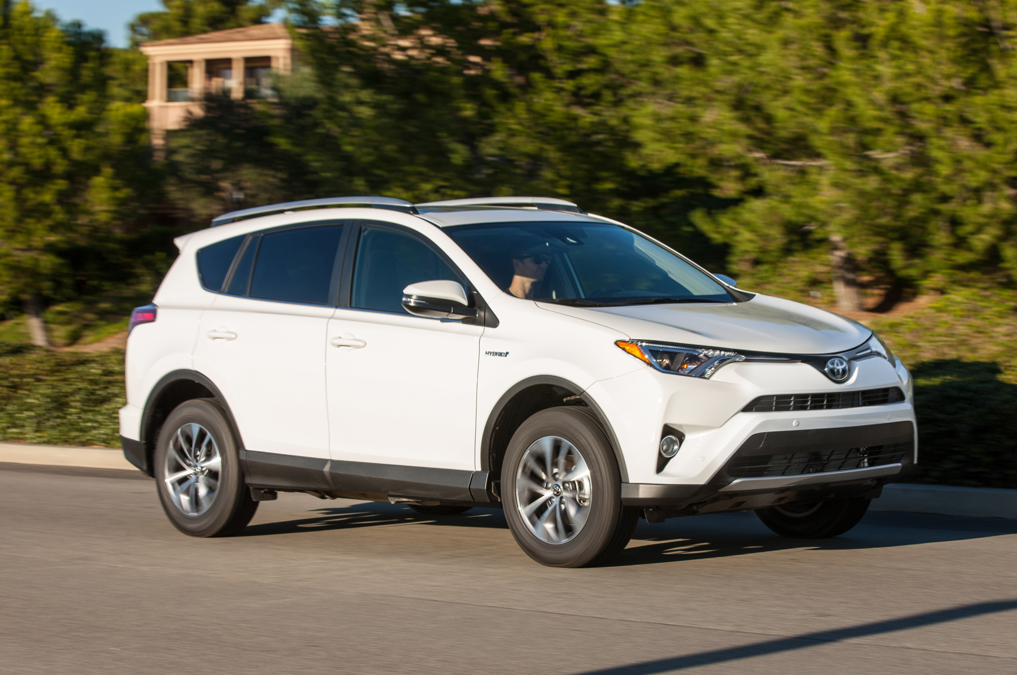 2016 Toyota RAV4 Hybrid XLE Front Three Quarter In Motion 02